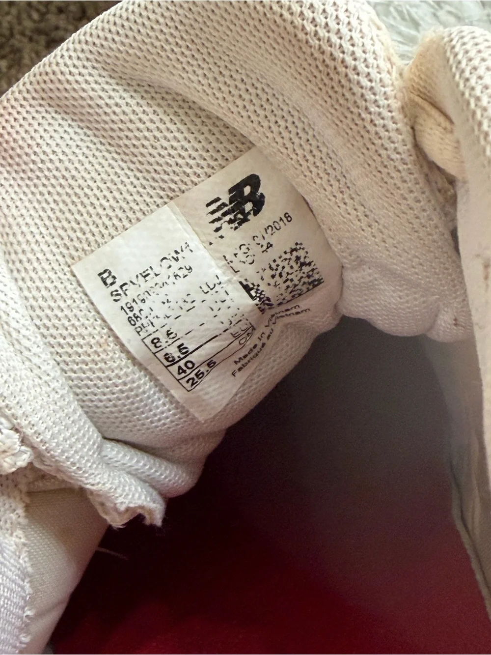 New Balance womens White and Beige Cleats